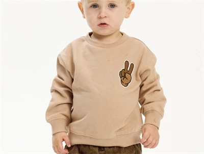 Sweatshirt i humus fra THE NEW siblings med smiley print foran og bagpå  