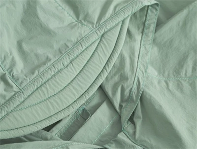 Mini A Ture Matasla uv overgangsjakke i basil green med let haette