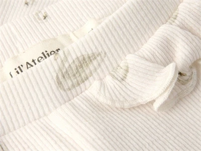 Lil\' Atelier BABY leggings i pastel parchment med svaneprint og flæser