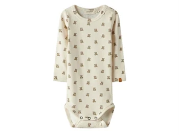lil' atelier body i beige med teddy bear-print og trykknapper, set forfra