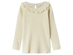 lil' atelier top i creme med flæsekant ved halsen og hjerter, set forfra