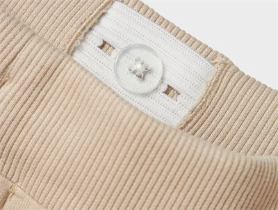 Name It Jurassic World sweatpants i råhvid nuance med dinosaurprint