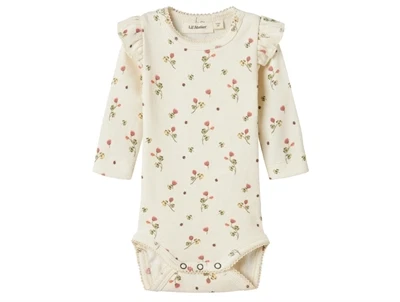Lil' Atelier body turtledove med blomsterprint og flæser