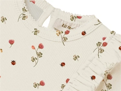 Lil\' Atelier kjolebody i råhvid nuance med flæsedetaljer og mariehøns
