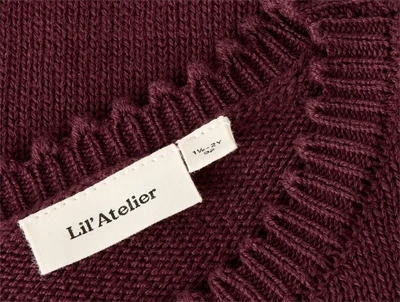 Lil\' Atelier strikbluse med bølgekant detaljer