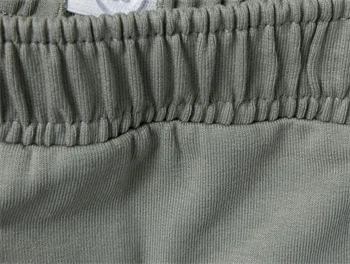 Nærbillede af talje og materiale på Lil\' Atelier bukser i seagrass