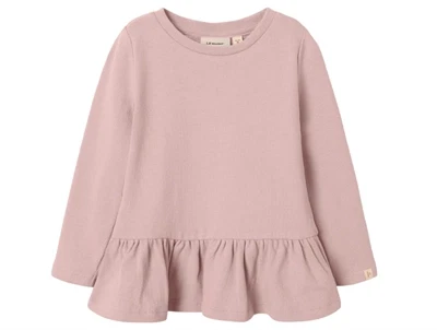 Lil' Atelier bluse i rosa nuance med peplumkant