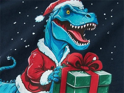 Detalje af jule dino print på blå bluse fra Name It