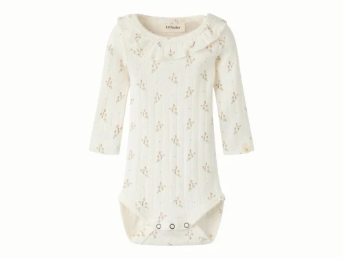 Lil\' Atelier body i råhvid nuance med blomsterprint set forfra