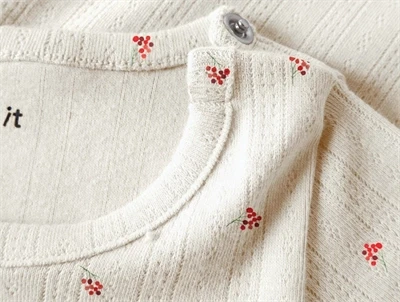 Name It body i beige nuance peyote melange med trykknapper ved skulder