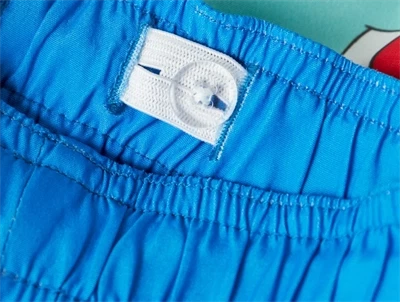 Name It badeshorts electric blue lemonade med Pokémon motiv og justerbar elastik