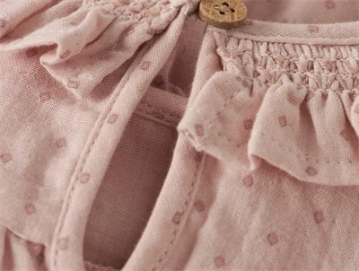 Lil\' Atelier body peach whip med smockdetalje