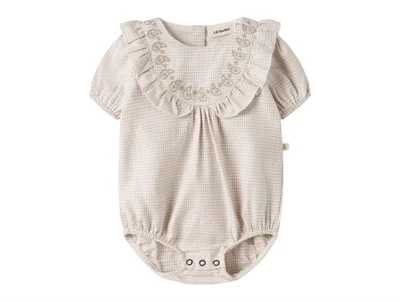 Lil' Atelier body i råhvid nuance set forfra
