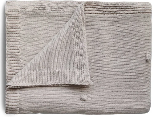 Mushie textured dots off white melange strikket babytæppe