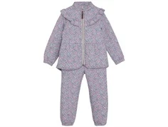 en fant termosæt i lys nuance med blomsterprint og flæser, set forfra