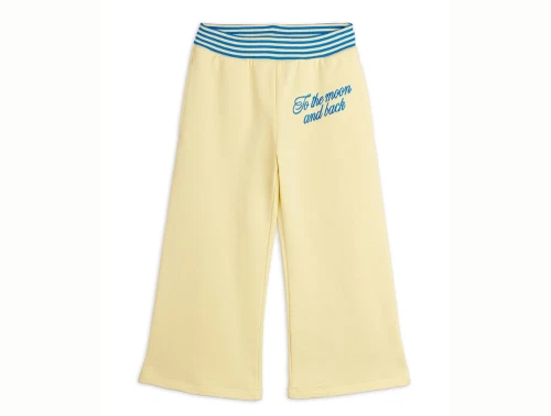 Mini Rodini sweatpants i yellow med to the moon broderi set forfra