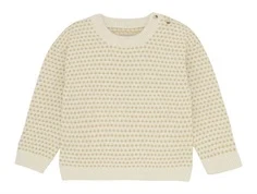 huttelihut striktrøje i naturhvid med sandfarvet mønster og knaplukning ved halsen