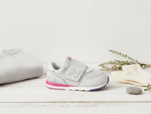 New Balance gray matter/signal pink 574 sneaker