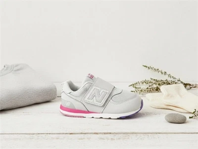 New Balance gray matter/signal pink 574 sneaker