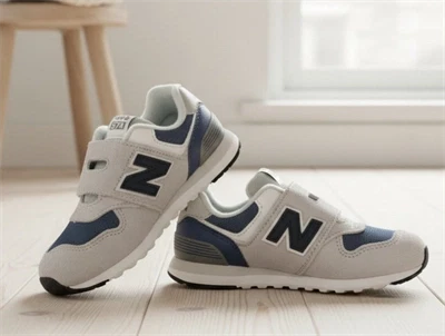 New Balance 574 prewalker sneaker i grå nuance med velcrolukning