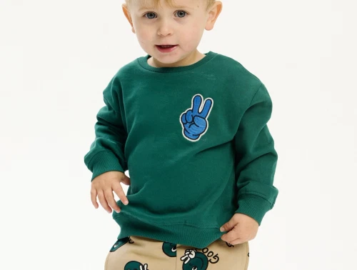 THE NEW Siblings sweatshirt grøn med blå smiley og teksten Good bagpå