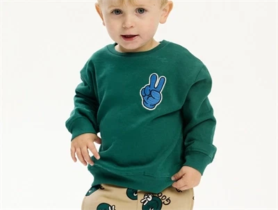 THE NEW Siblings sweatshirt grøn med blå smiley og teksten Good bagpå